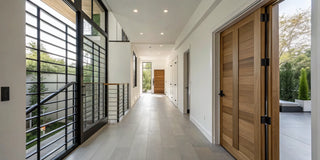 A stylish safety gate for a doorway in a modern, well-lit home.