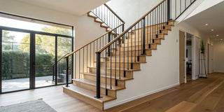 Modern wooden staircase perfect for installing one of the best retractable stair gates.