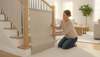 Parent checking the fabric panel of a stair safety gate