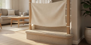 Fabric stair barrier fitted across a carpeted staircase in a bright, neutral home
