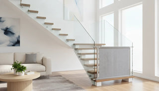 Modern glass staircase with a stylish fabric safety gate installed