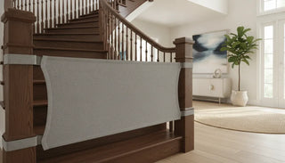 The Stair Barrier Banister-to-Banister fabric safety gate mounted on wooden stairs