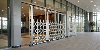 A modern collapsible gate providing security for a home's entryway.