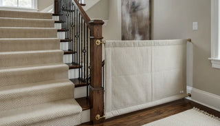 Fabric custom baby gate fitted between a banister and wall