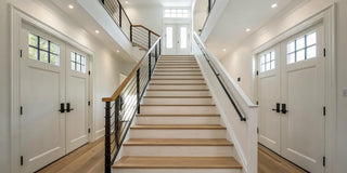 A door at the top of the stairs with a proper landing, meeting safety regulations.