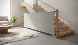 A premium sustainable fabric baby safety gate installed at the bottom of a beautiful wooden staircase