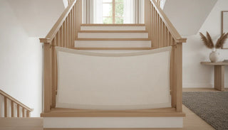 Fabric stair gate installed between wooden banisters