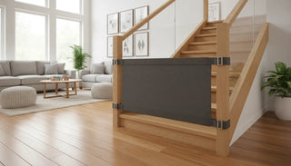 Modern stylish baby-proof staircase with a charcoal fabric baby gate installed without damage using a strap-and-buckle system