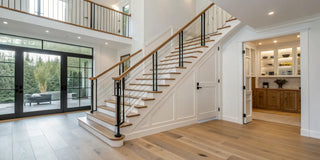 A modern, open staircase with a wide landing, an awkward space that needs a special stair gate.