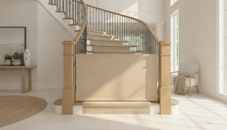 A stylish fabric baby gate installed at the bottom of foyer stairs blending with modern home decor