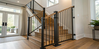 Expertly installed black safety gate on a modern staircase for home safety.
